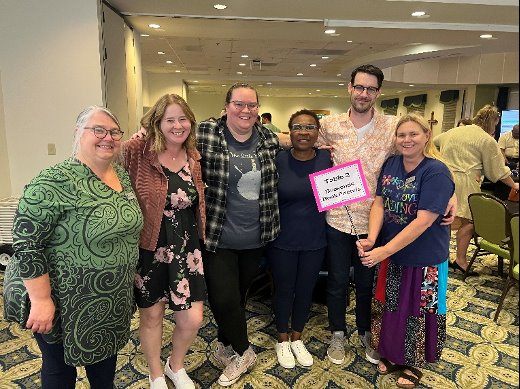 RPL's scrabble scramble team members pose together and smile for the camera
