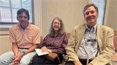 David Whisenant, Deidre Parker-Smith, and Mark Wineka smile for the camera. They are seated next to each other in front of a window.