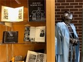 a photo of RPL South's display case featuring various yearbooks and other local school memorabilia