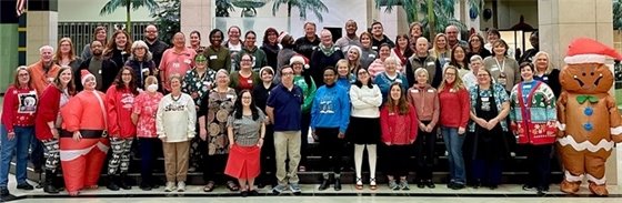 RPL staff smile for the camera in their festive holiday attire