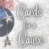 red, white, and blue patriotic ornament with the words cards for a cause next to it