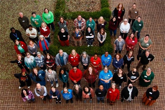 An overhead shot of RPL employees posing for the camera