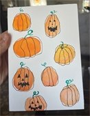 image of orange watercolor pumpkins with black line drawing details